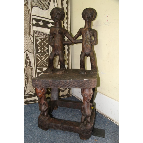 2028 - African: a Chokwe chair, with twin figure back and front supports.