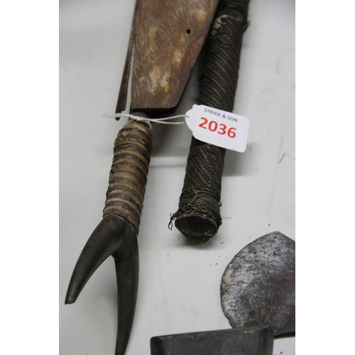 2036 - African: a short knife, having forked horn handle and curved blade, in part leather bound wooden sca... 