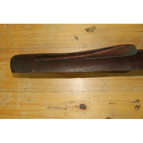 2049 - Oceanic: an old Solomon Islands (Malaita) club or staff, carved with angular face, approx 100cm long... 