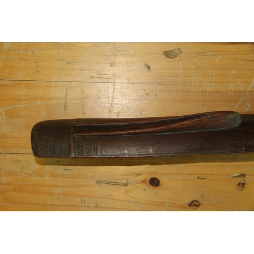 2049 - Oceanic: an old Solomon Islands (Malaita) club or staff, carved with angular face, approx 100cm long... 