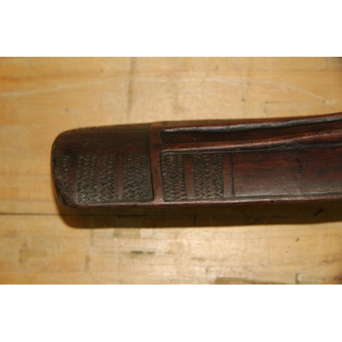 2049 - Oceanic: an old Solomon Islands (Malaita) club or staff, carved with angular face, approx 100cm long... 