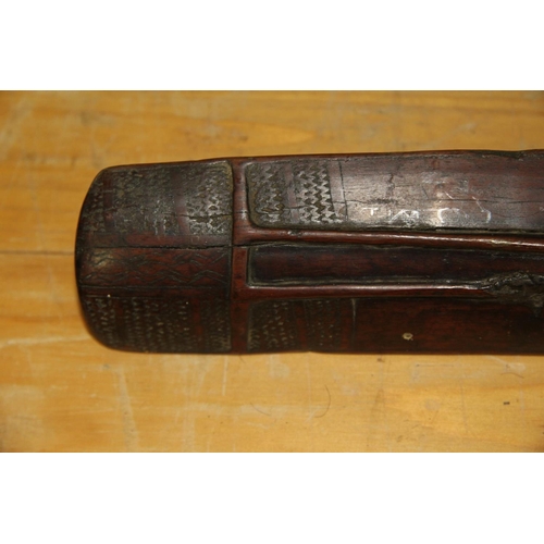 2049 - Oceanic: an old Solomon Islands (Malaita) club or staff, carved with angular face, approx 100cm long... 