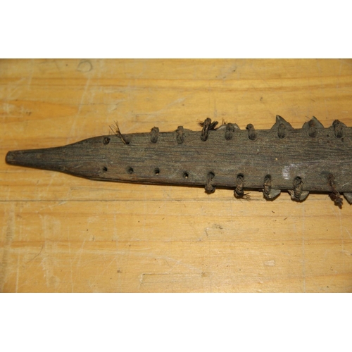 2054 - Oceanic: an old Gilbert Islands wooden weapon, the blade having shark's teeth to either side of the ... 