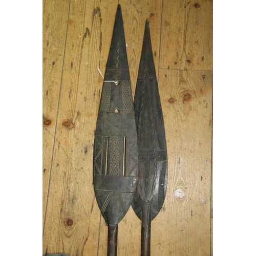 2055 - African: two large Benin Jekri paddles, having carved blades and handles, approx 150cm long. (2)