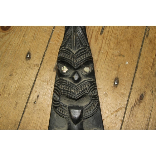 2057 - Oceanic: a 20th century Maori ornamental canoe paddle, carved tiki masks with inlaid shell eyes, app... 