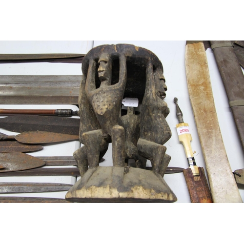 2061 - African: a stool supported by four standing figures, 31.5cm high.