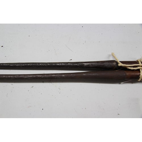 2066 - African: two Maasai spears, with long steel heads and tips, approx 198cm long.