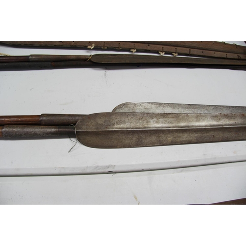 2069 - African: two Maasai spears having large steel heads, (89cm and 96.5cm long) and long metal tips, tot... 