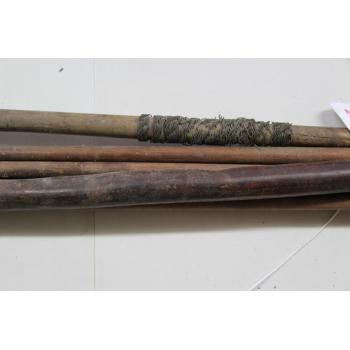 2081 - African: a bow, approx 117cm long; together with five metal tipped arrows; and a wooden stick. (7)