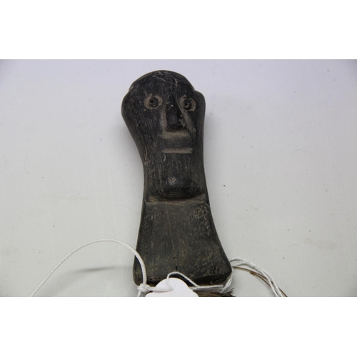 2085 - African: a knife having carved wood handle and snakeskin scabbard, approx 48cm long.