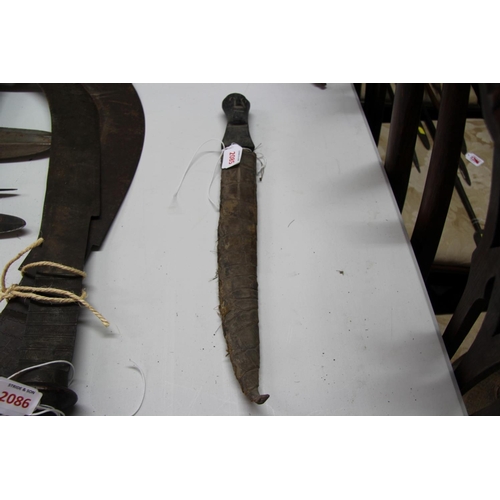 2085 - African: a knife having carved wood handle and snakeskin scabbard, approx 48cm long.