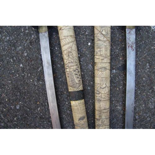 2096 - Two Japanese swords, having carved bone scabbards and copper mounted handles, (a.f).