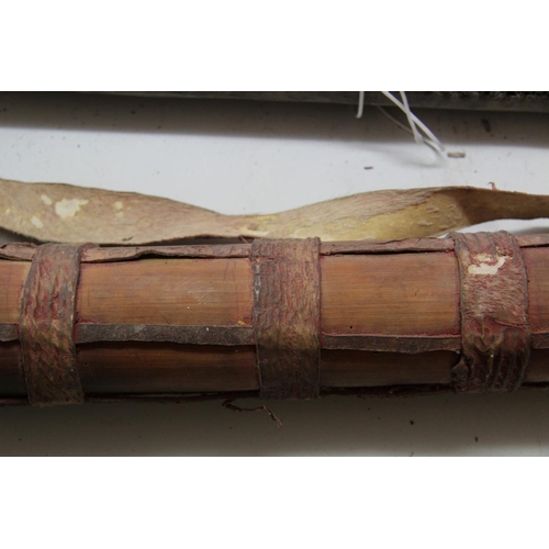 2098 - African: an old quiver containing hunting arrows, 76cm long, with shoulder strap.