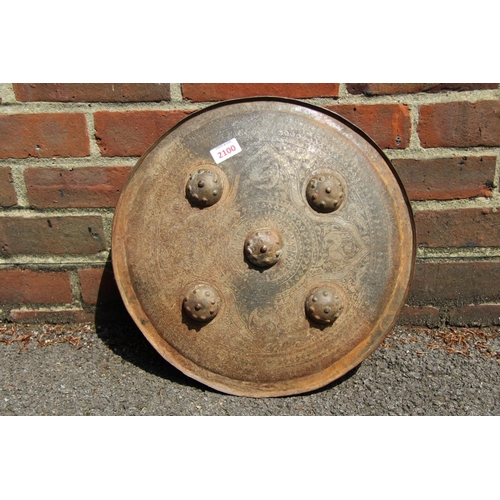 2100 - An Afghan metal shield, 43cm diameter.