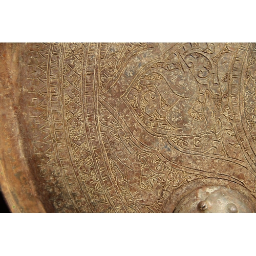 2100 - An Afghan metal shield, 43cm diameter.