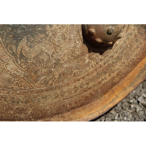 2100 - An Afghan metal shield, 43cm diameter.