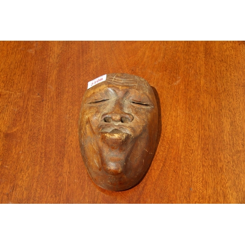 2108 - An Inuit carved wood burial mask, 21 x 14cm.