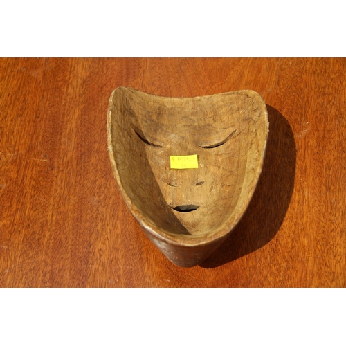 2108 - An Inuit carved wood burial mask, 21 x 14cm.