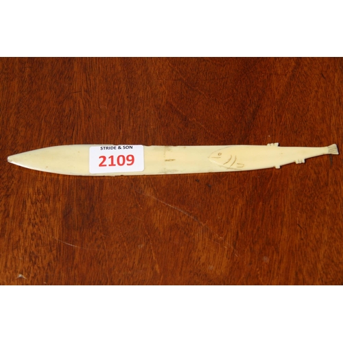 2109 - An Inuit style ivory small knife, probably marine ivory, with fish form handle, 23cm long.