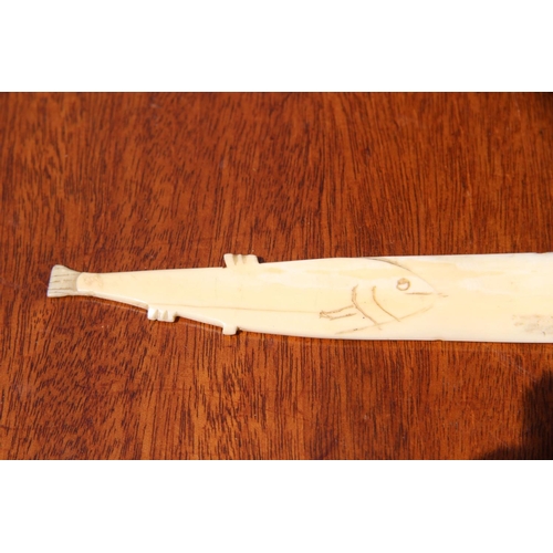 2109 - An Inuit style ivory small knife, probably marine ivory, with fish form handle, 23cm long.