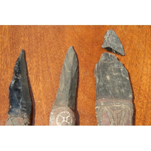 2111 - Oceanic: three Admiralty Island daggers with obsidian blades, the handles carved and decorated with ... 