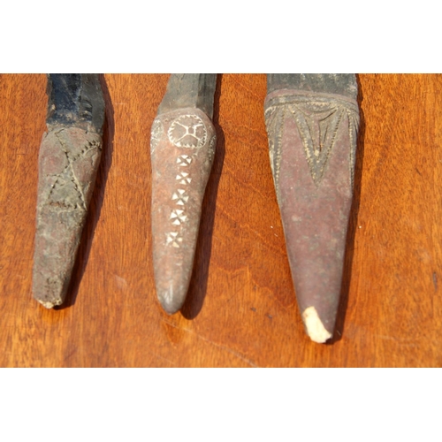 2111 - Oceanic: three Admiralty Island daggers with obsidian blades, the handles carved and decorated with ... 