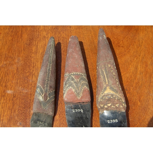 2112 - Oceanic: three Admiralty Island daggers with obsidian blades, the handles carved and decorated with ... 