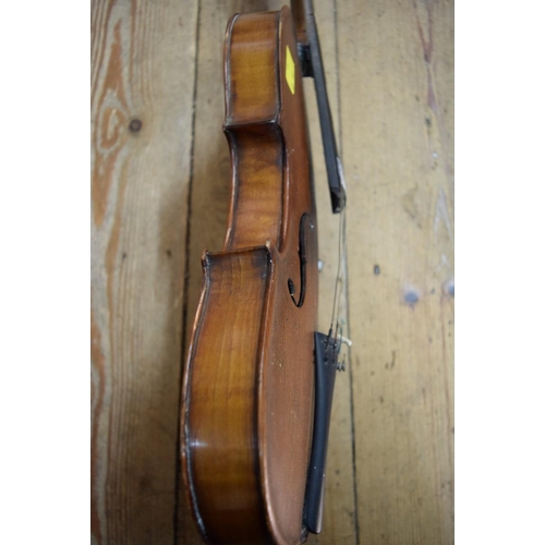 1863 - A antique Continental violin, with 14in walnut back, cased.