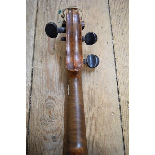 1863 - A antique Continental violin, with 14in walnut back, cased.