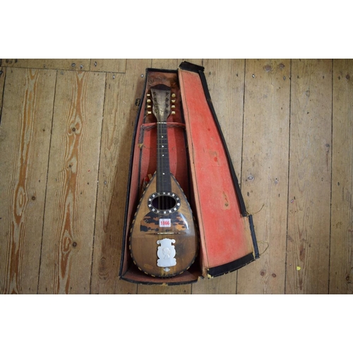 1866 - A rosewood and inlaid mandolin, cased.