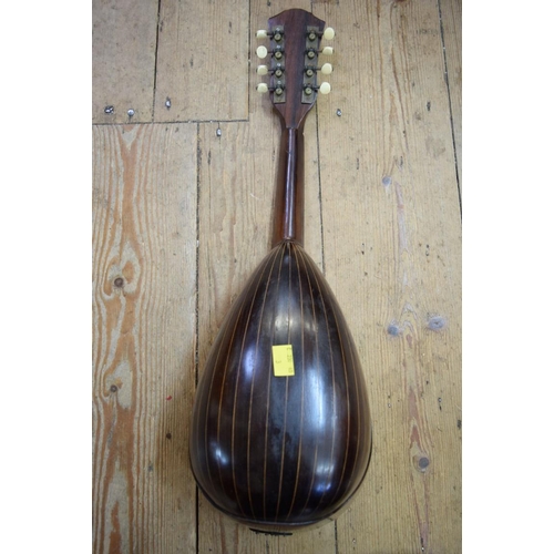 1866 - A rosewood and inlaid mandolin, cased.