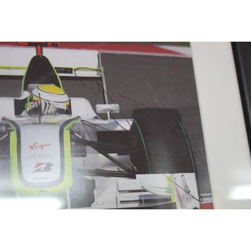 1889 - Formula One: a signed photograph of Jensen Button in Grand Prix car, 19.5 x 29.5cm. £30 - 50