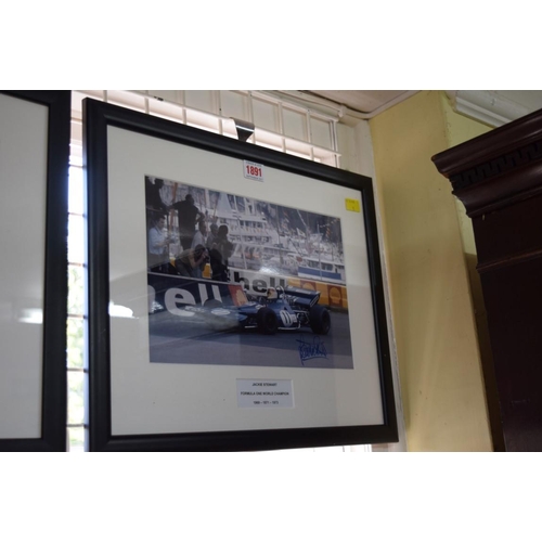 1891 - Formula One: a signed photograph of Jackie Stewart in Grand Prix car, 19.5 x 29.5cm.