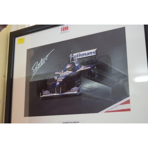 1898 - Formula One: a signed photograph of Jacques Villeneuve in Grand Prix car, 19.5 x 29.5cm. £30 - 40