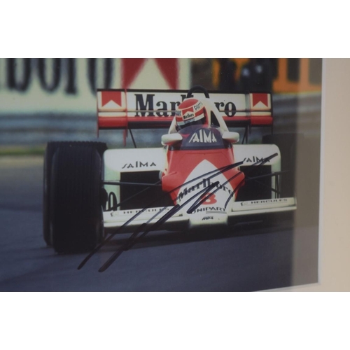 1903 - Formula One: a signed photograph of Niki Lauda in Grand Prix car, 19.5 x 29.5cm. £30 - 40