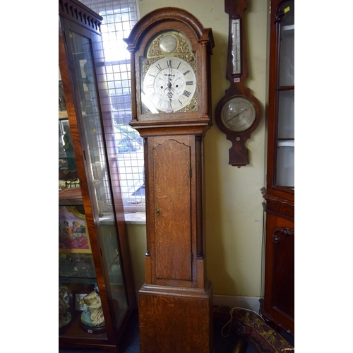 1918 - An oak 8 day longcase clock, the 12in arched dial inscribed 'Ts Farmer, Stockton', 205cm high, with ... 