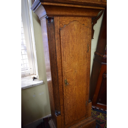 1918 - An oak 8 day longcase clock, the 12in arched dial inscribed 'Ts Farmer, Stockton', 205cm high, with ... 