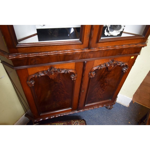 1924 - A Victorian carved mahogany standing corner cupboard, 226cm high x 131cm wide.