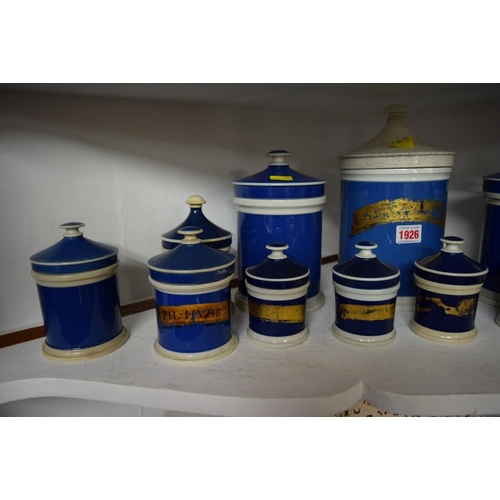 1926 - A collection of twenty-two Victorian blue and white pottery apothecary jars and covers, largest 25cm... 