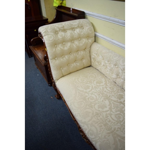 1931 - A reproduction button upholstered chaise longue, in damask fabric.