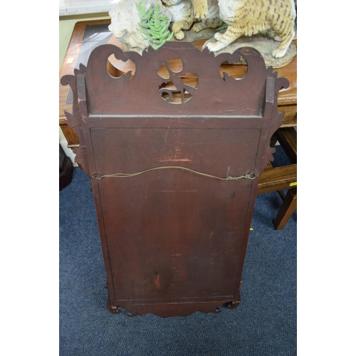 1941 - A Georgian style yew wood and silvered fret framed wall mirror, 93.5 x 53cm.