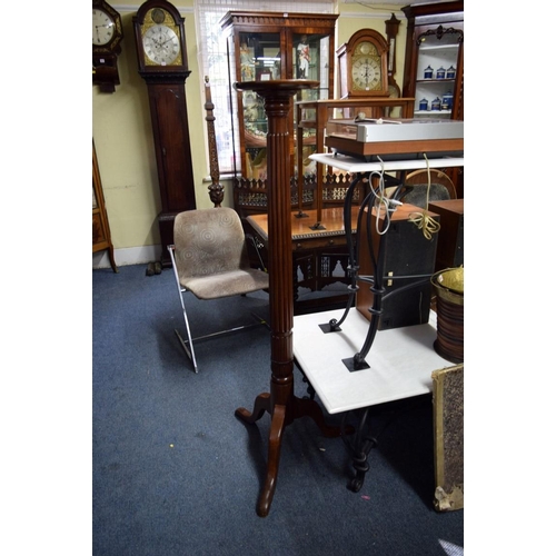 1952 - A pair of mahogany bedpost torcheres.