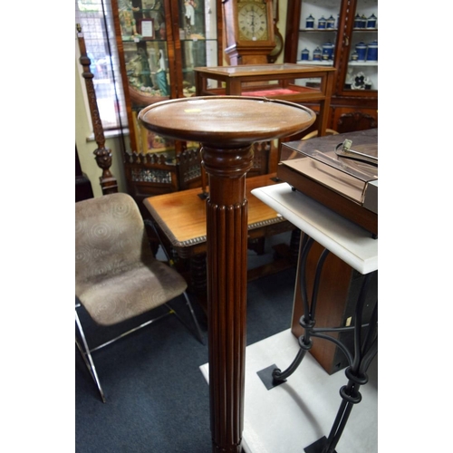 1952 - A pair of mahogany bedpost torcheres.