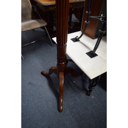 1952 - A pair of mahogany bedpost torcheres.