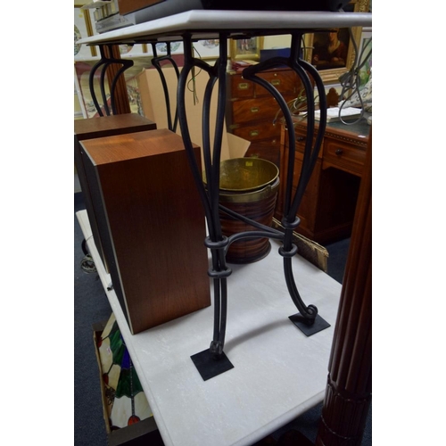 1953 - Two marble top wrought iron tables, 140 and 119.5cm wide.