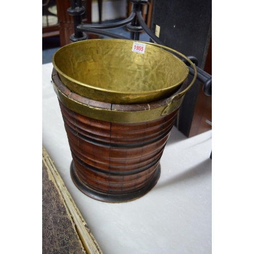 1955 - A 19th century walnut and ebonized peat bucket, with brass swing handle and associated liner, 46cm h... 