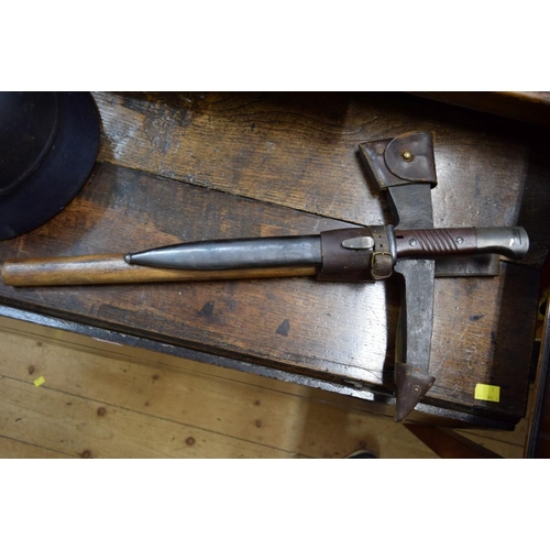 1969 - A German Third Reich Luftschutz combat helmet; together with a K98 bayonet and escape axe, in leathe... 