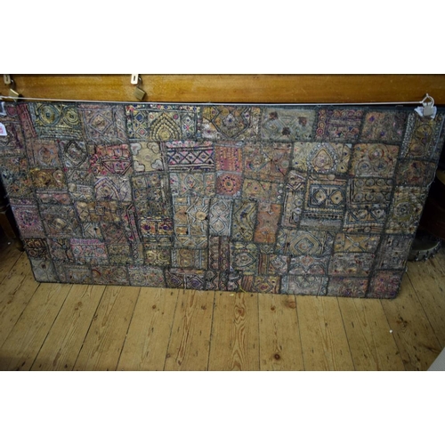 1970 - An Indian patchwork textile panel, 73 x 148cm.