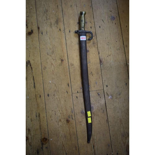 1972 - A French bayonet and steel scabbard, the blade inscribed and dated 1873, total length 72cm.