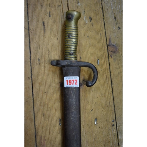 1972 - A French bayonet and steel scabbard, the blade inscribed and dated 1873, total length 72cm.